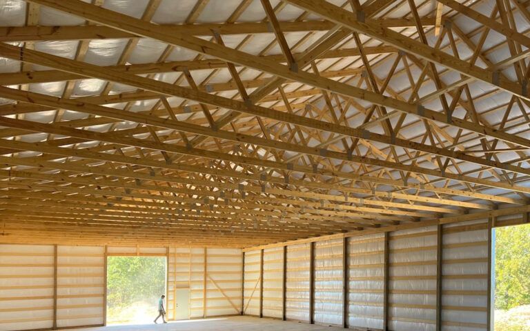 interior of pole barn building with products from capital truss